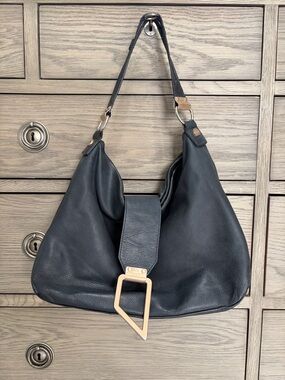 Foley & Corinna Black Leather Shoulder Bag with Modern Gold Accents